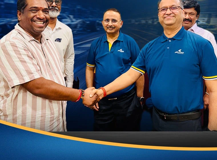 CTR and JK Tyre representatives sealing the partnership with a handshake.