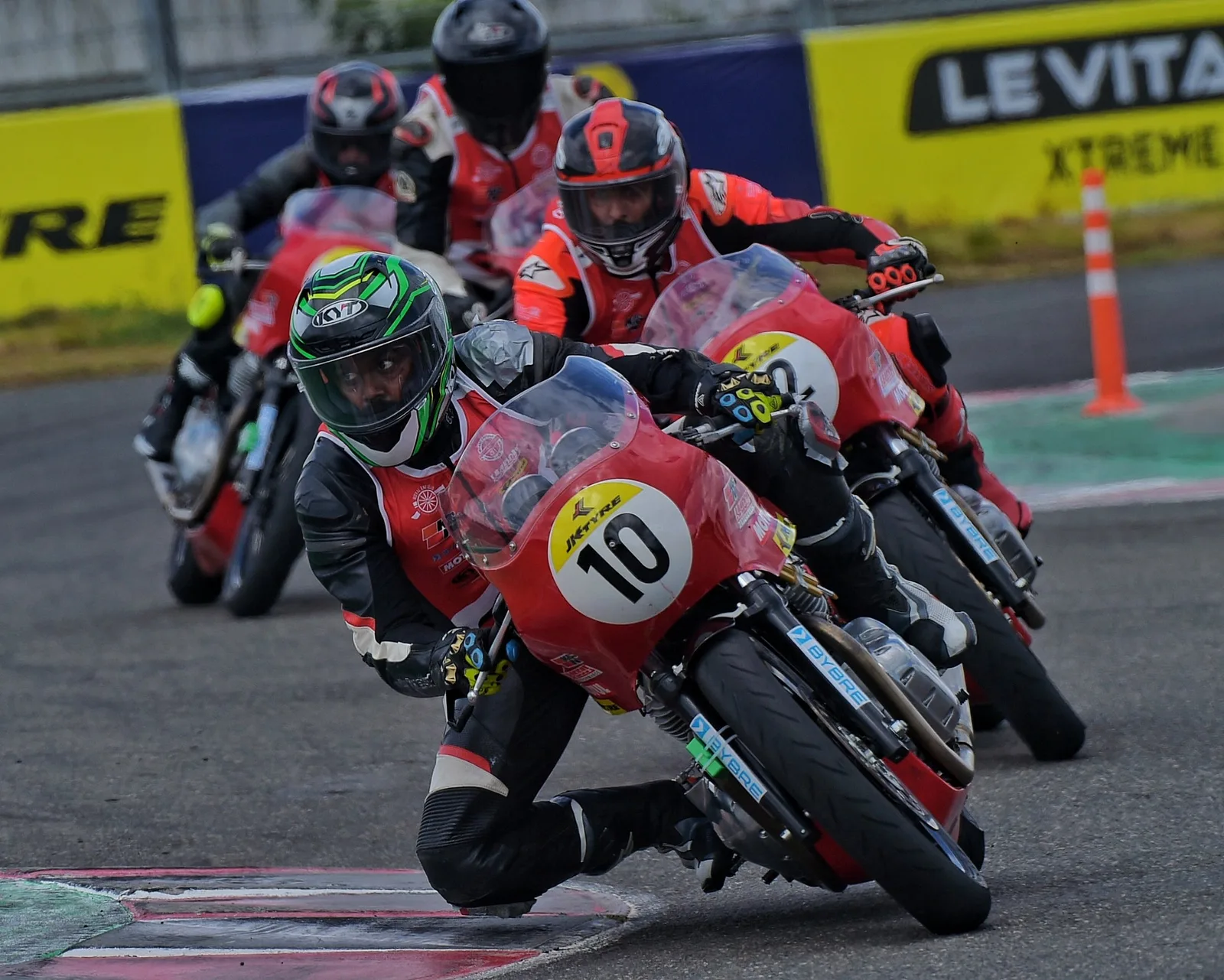 Royal Enfield Continental GT riders leaning into a corner