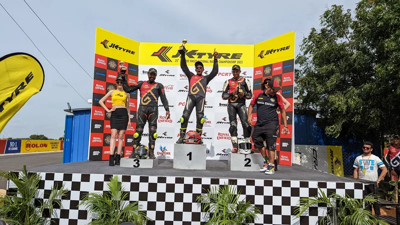 Drivers celebrate on the podium at Kari Motor Speedway