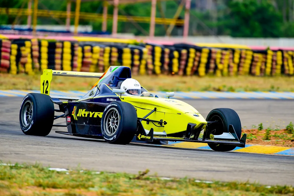 A yellow JK Tyre-liveried formula car on track